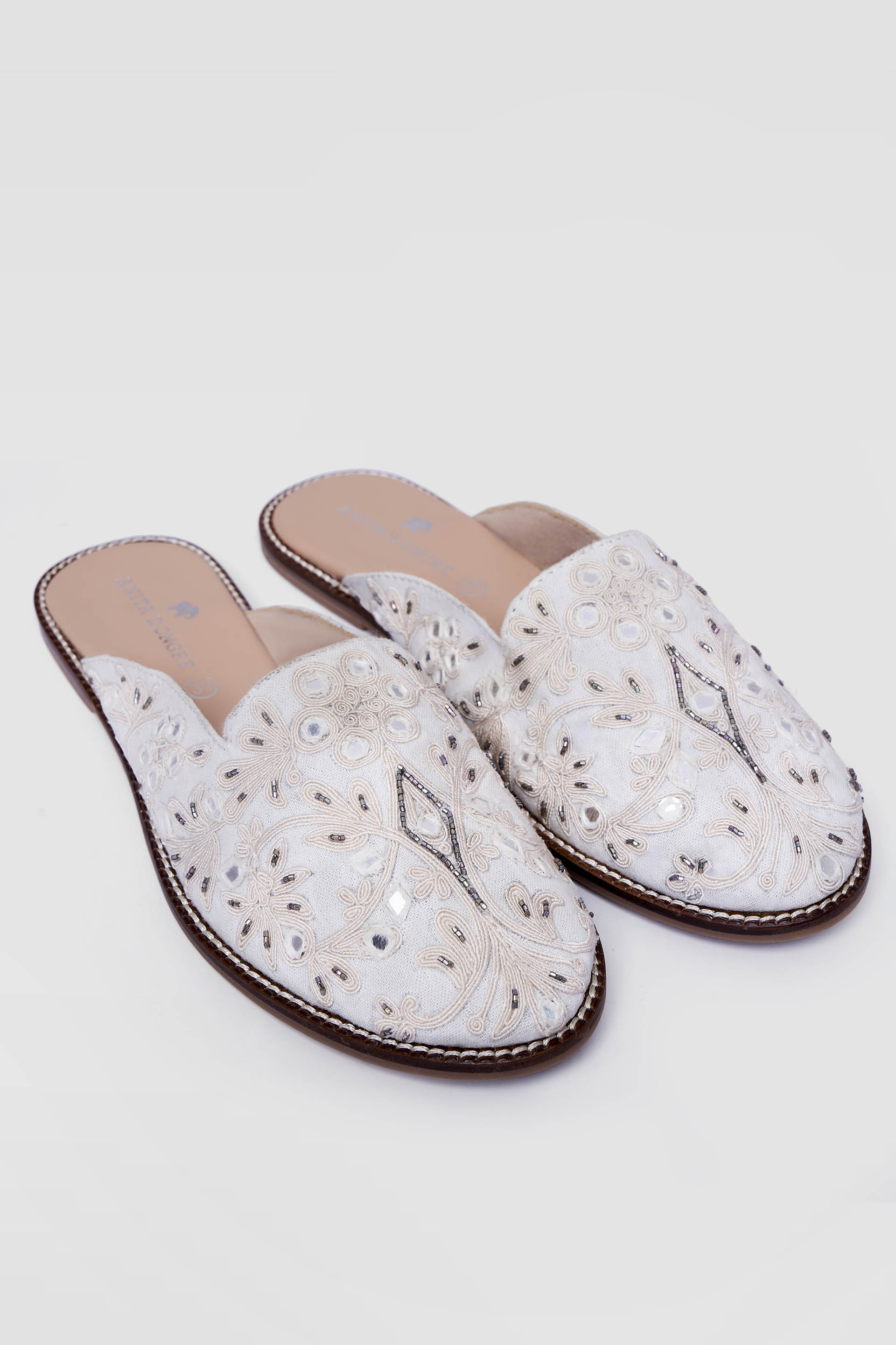 Ivory mules on sale